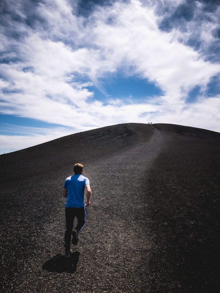 Man running uphill to get fit in New Year