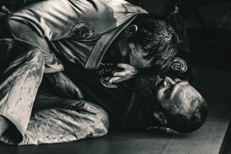 man in black shirt lying on floor